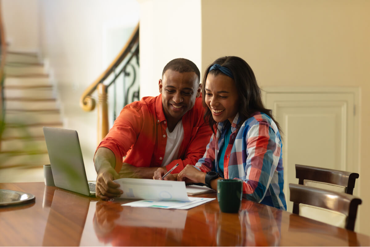 smiling-african-american-couple-discussing-on-fina-2022-01-31-18-22-32-utc.jpg